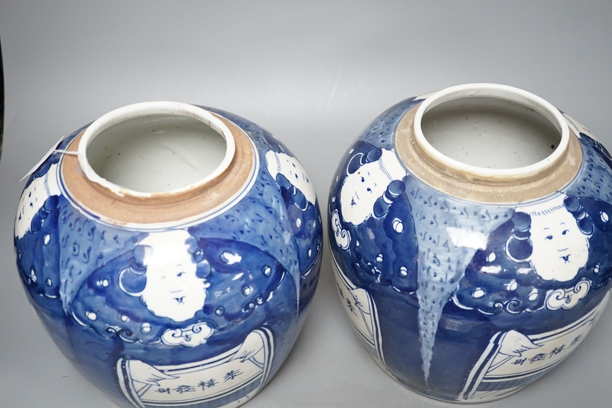 A pair of Chinese blue and white ovoid jars and covers, 25cm